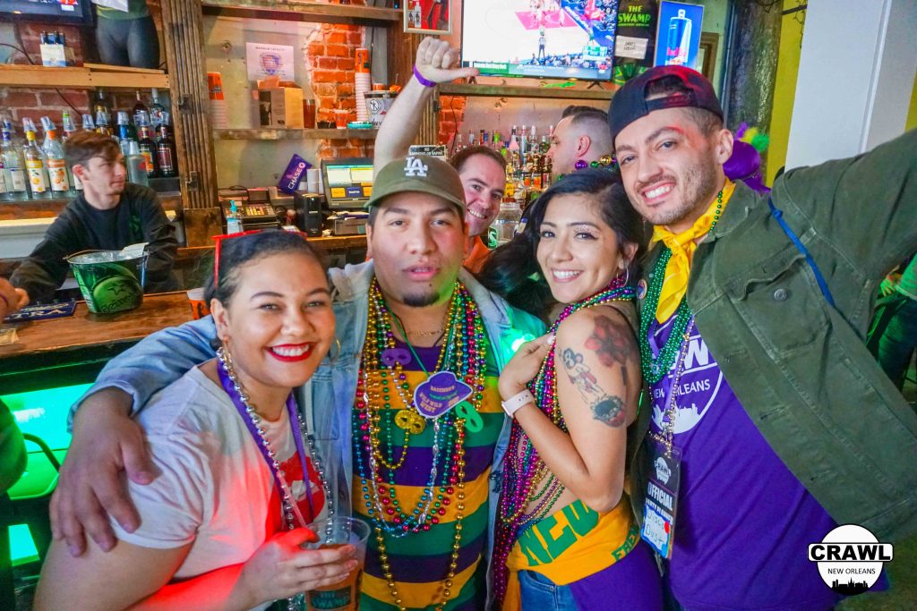 A group of people partying on Bourbon Street for Mardi Gras