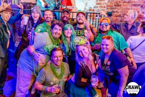 Group of friends enjoying a VIP bar crawl in the French Quarter